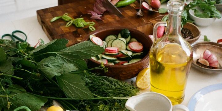 Person Slicing Vegetables on Chopping Board