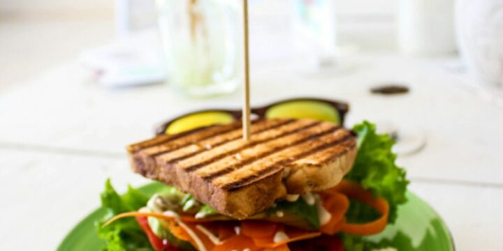 skewered sandwich on green plate