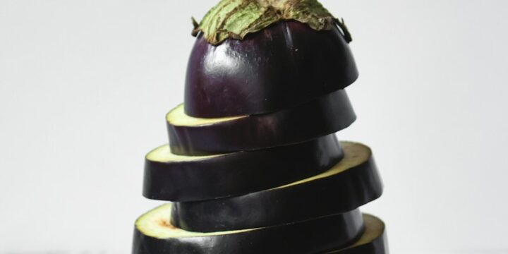 green bell pepper on black and white stripe textile