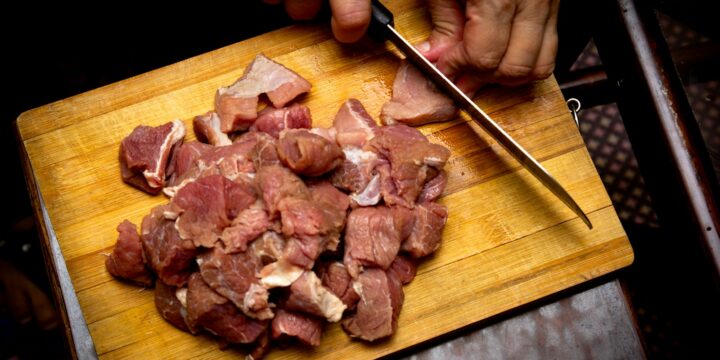 sliced meat on brown wooden chopping board